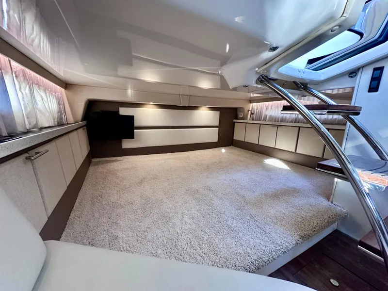 Slide: The Image of Luxurious interior of a 2017 Regal 32 Express yacht with plush carpeting and modern design. - 44