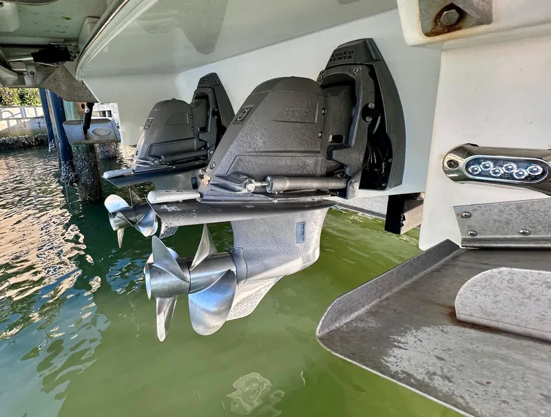 Slide: The Image of 2017 Regal 32 Express boat with dual propellers in water. - 47