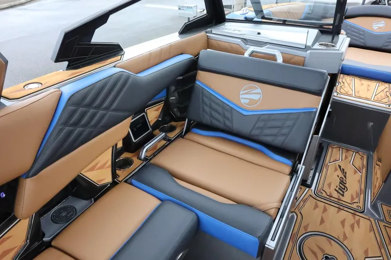 Slide: The Image of 2025 Tigé Ultré 25ZX boat interior with luxurious seating and modern design. - 14