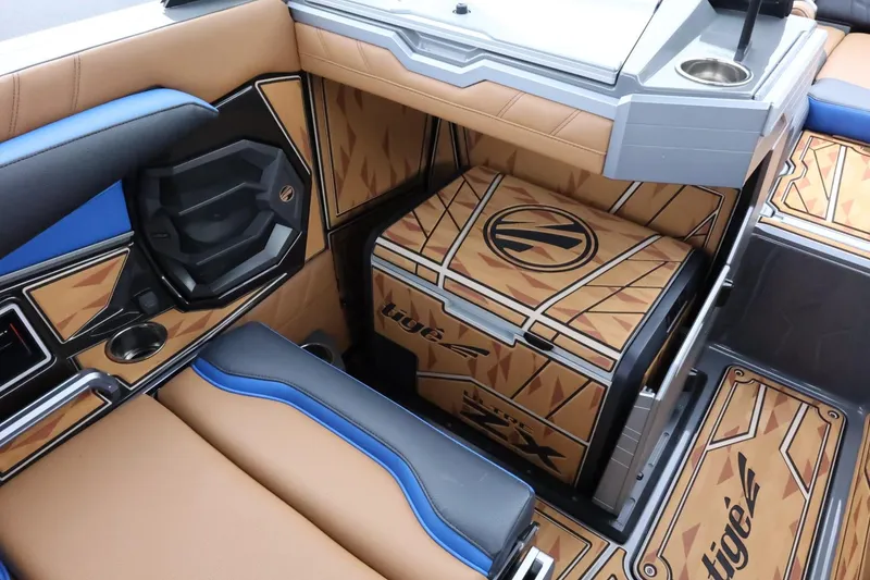 Slide: The Image of 2025 Tigé Ultré 25ZX boat interior with stylish seating and custom flooring. - 16