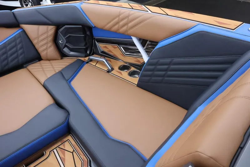 Slide: The Image of Luxurious interior of 2025 Tigé Ultré 25ZX boat with stylish seating and cup holders. - 19