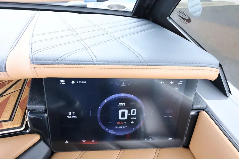 Slide: The Image of 2025 Tigé Ultré 25ZX dashboard with digital display and leather accents. - 31