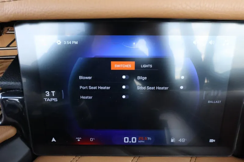 Slide: The Image of Touchscreen control panel in 2025 Tigé Ultré 25ZX boat, displaying switches and settings. - 35