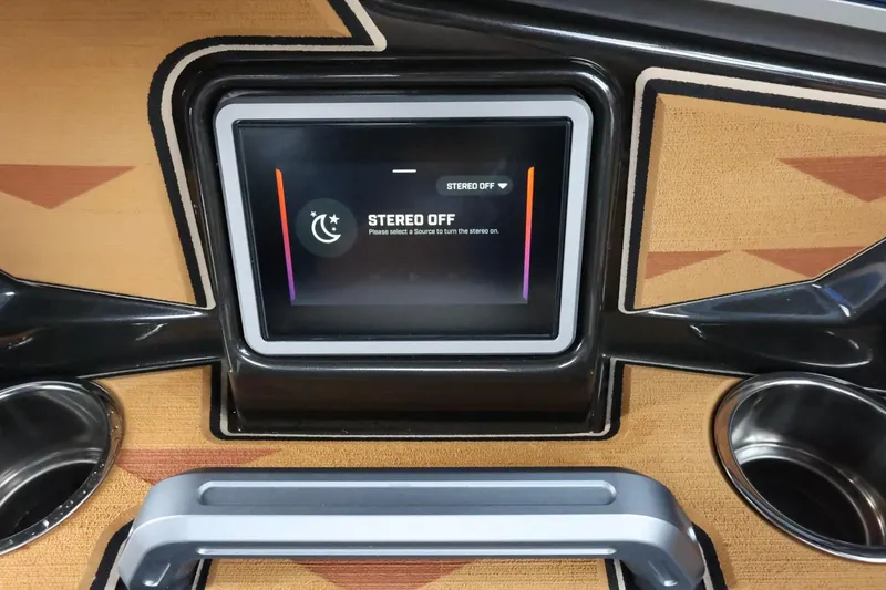 Slide: The Image of 2025 Tigé Ultré 25ZX dashboard with stereo display, cup holders, and sleek design. - 41
