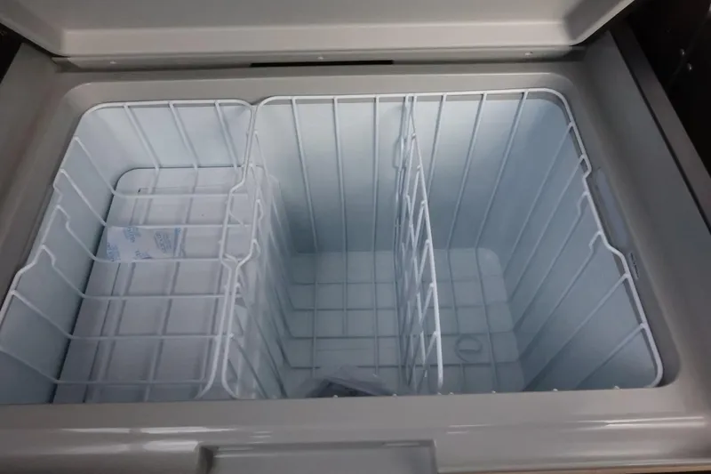 Slide: The Image of Open storage compartment in 2025 Tigé Ultré 25ZX boat. - 44