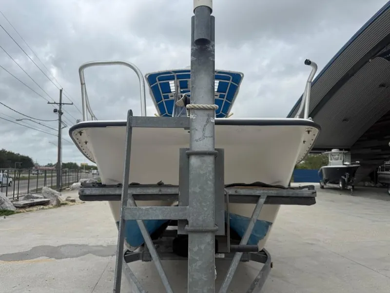 Slide: The Image of 2005 Twin Vee 26 Center Console boat on trailer, parked outdoors. - 6