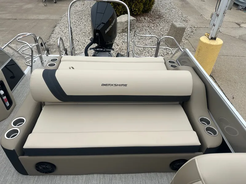 Slide: The Image of Berkshire CTS Series 24UL CTS 2025 pontoon boat with beige seating area. - 18