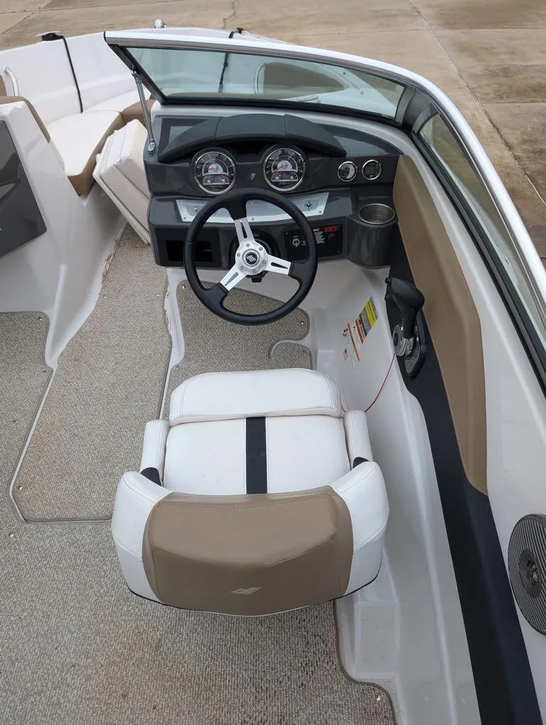 Slide: The Image of 2016 Four Winns 180 Horizon boat interior with steering wheel and dashboard. - 3