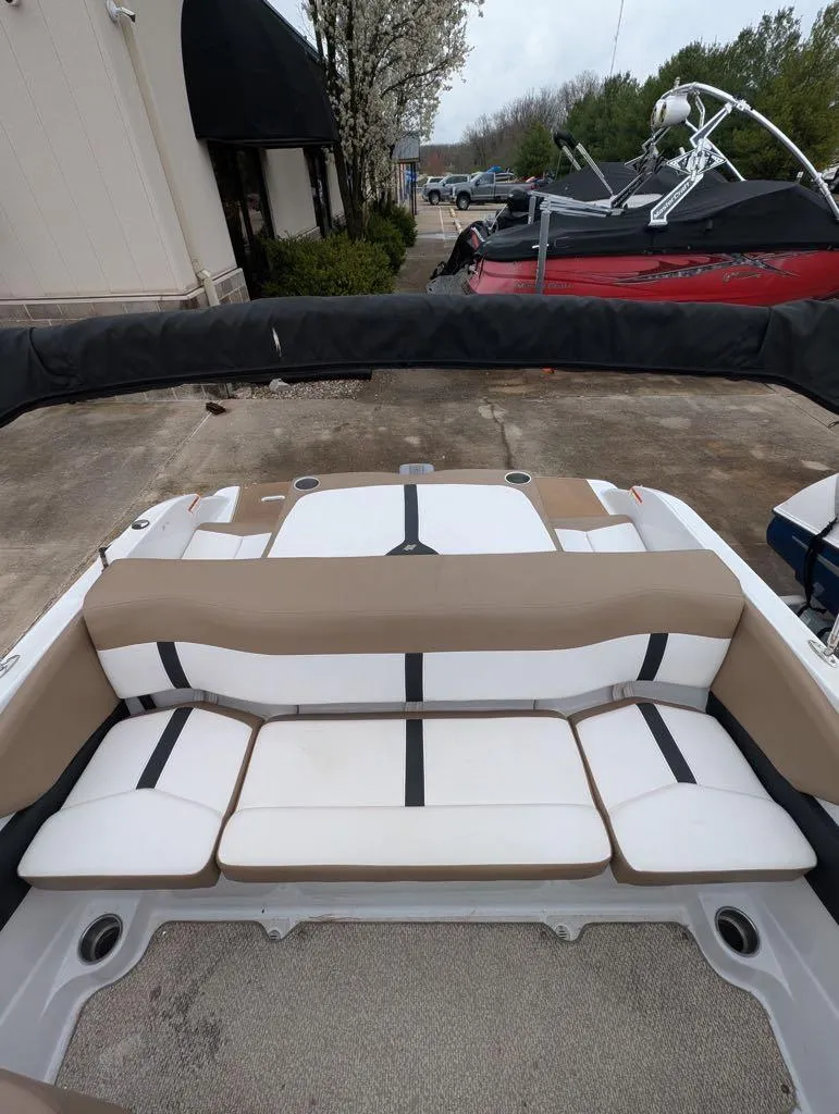 Slide: The Image of 2016 Four Winns 180 Horizon boat interior with beige and white seating. - 4