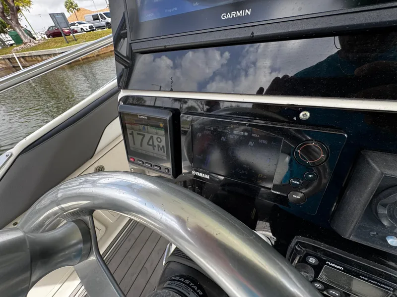 Slide: The Image of 2005 Hydra-Sports 3300 VX dashboard with Garmin display and Yamaha controls. - 18