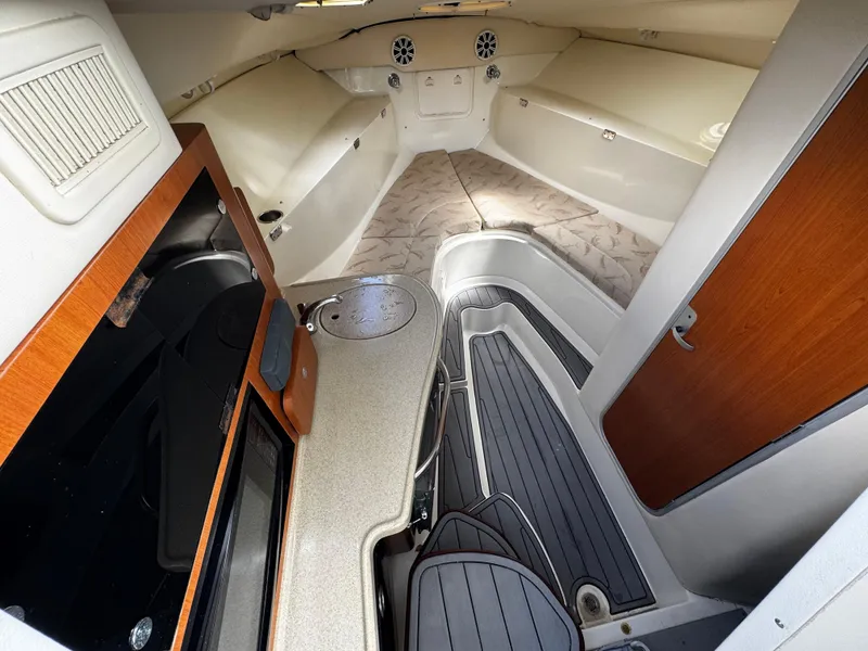 Slide: The Image of 2005 Hydra-Sports 3300 VX cabin interior with kitchenette and seating area. - 25