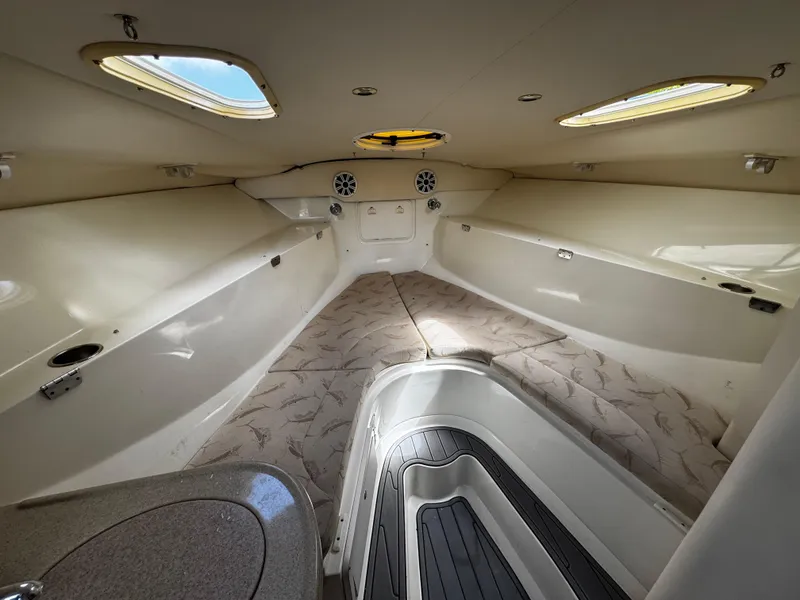 Slide: The Image of 2005 Hydra-Sports 3300 VX cabin interior with skylights and seating area. - 26