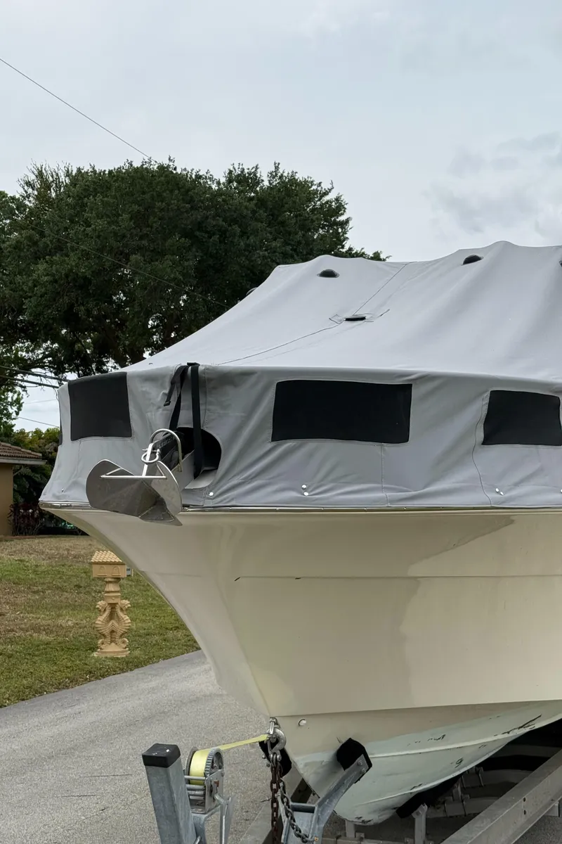 Slide: The Image of 2005 Hydra-Sports 3300 VX boat with cover on trailer, parked outdoors. - 35