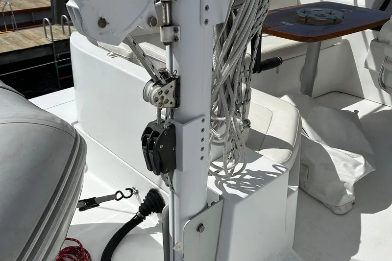 Slide: The Image of Beneteau 42 Swift Trawler 2006 deck with ropes and equipment in sunlight. - 19