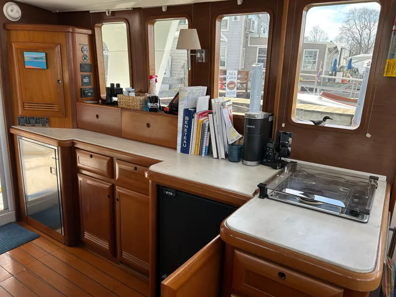 Slide: The Image of Interior of 2006 Beneteau 42 Swift Trawler with wooden cabinetry and modern amenities. - 27
