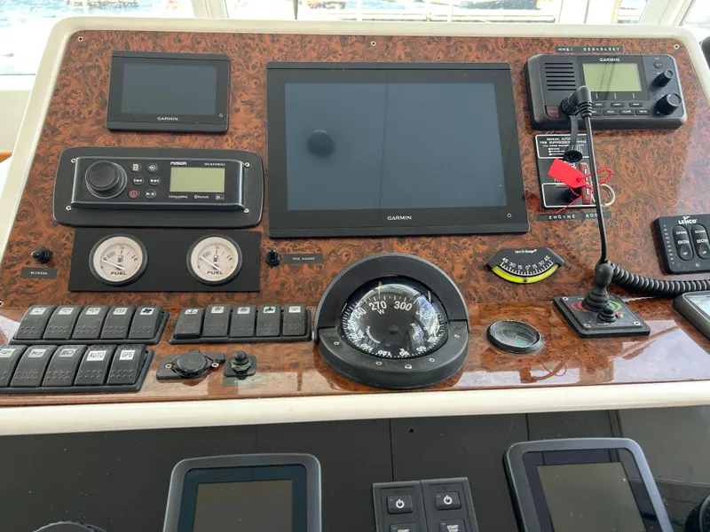 Slide: The Image of Control panel of a 2006 Beneteau 42 Swift Trawler with navigation instruments. - 36