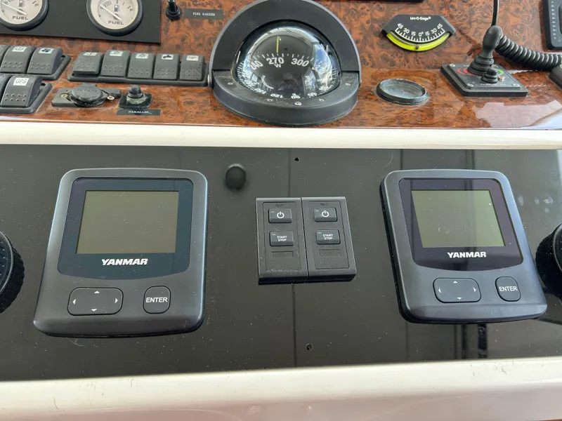 Slide: The Image of Control panel of 2006 Beneteau 42 Swift Trawler with Yanmar displays and navigation instruments. - 38