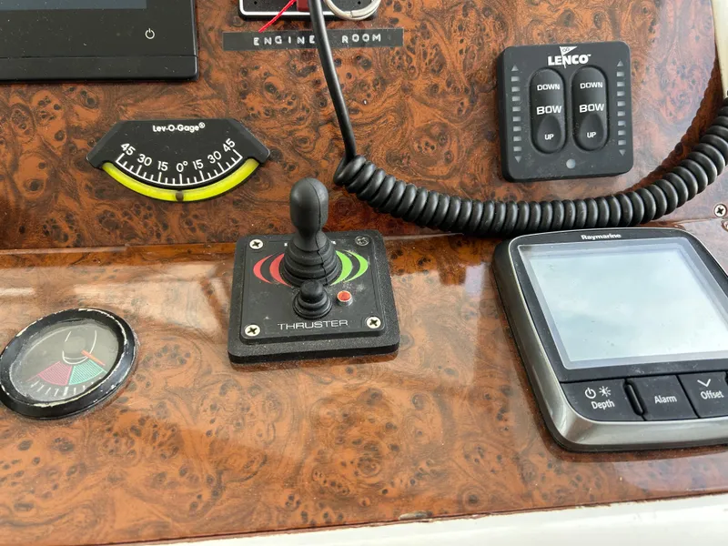 Slide: The Image of Control panel of a 2006 Beneteau 42 Swift Trawler with navigation instruments and thruster joystick. - 39