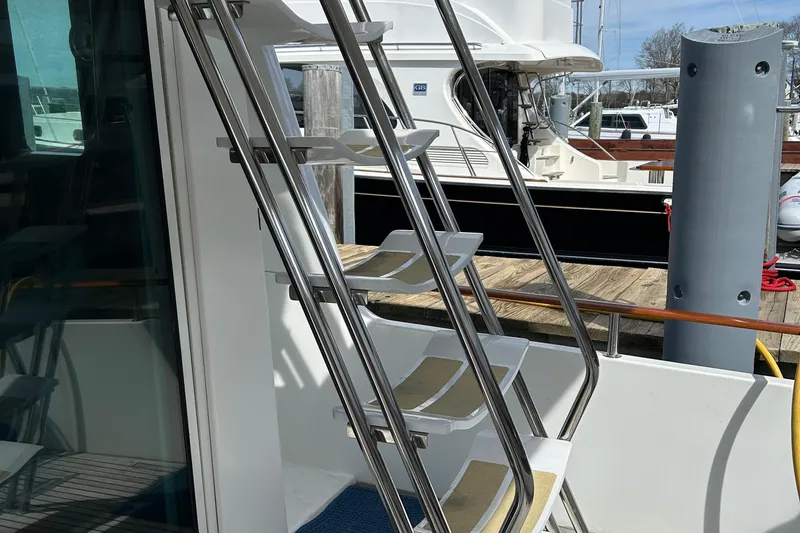 Slide: The Image of Stainless steel stairs on a 2006 Beneteau 42 Swift Trawler yacht. - 9