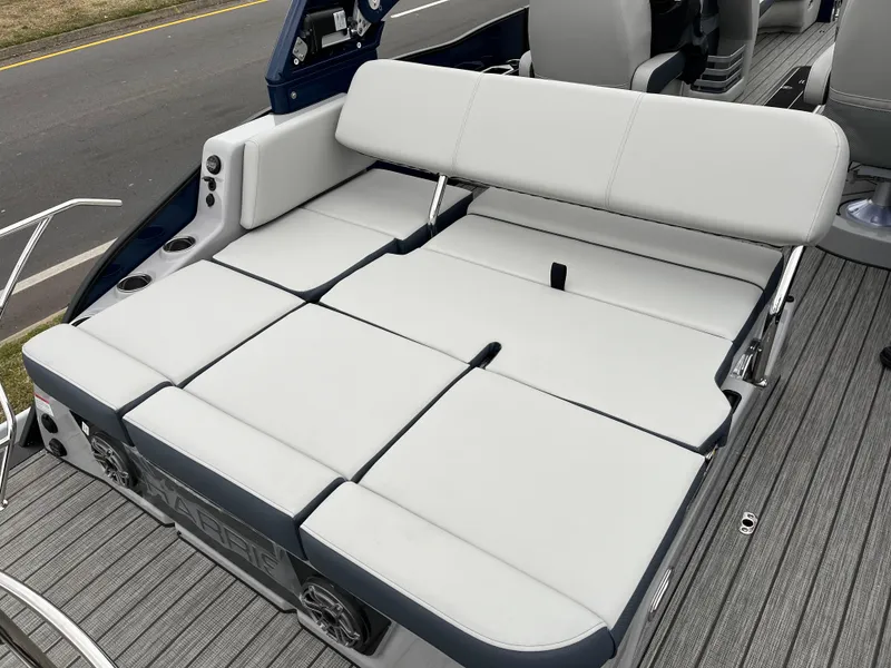 Slide: The Image of 2025 Harris Grand Mariner 250 boat with spacious, convertible seating and modern design. - 11