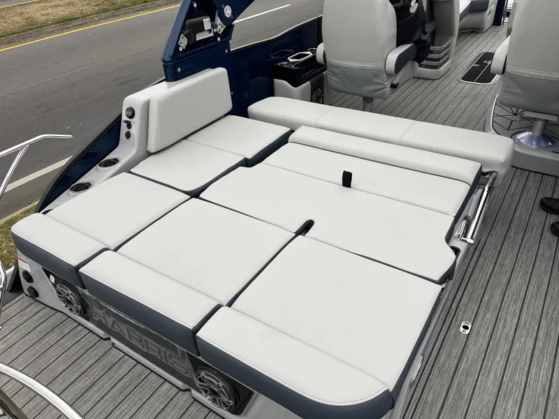 Slide: The Image of 2025 Harris Grand Mariner 250 boat with spacious seating and modern design. - 12