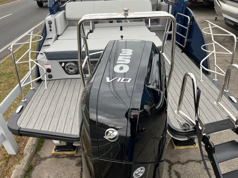 Slide: The Image of 2025 Harris Grand Mariner 250 boat with powerful 350 V10 engine, sleek design, and spacious deck. - 3