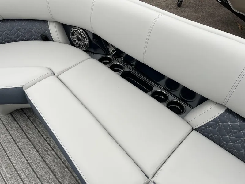 Slide: The Image of Luxurious seating on 2025 Harris Grand Mariner 250 boat with cup holders and speaker. - 7