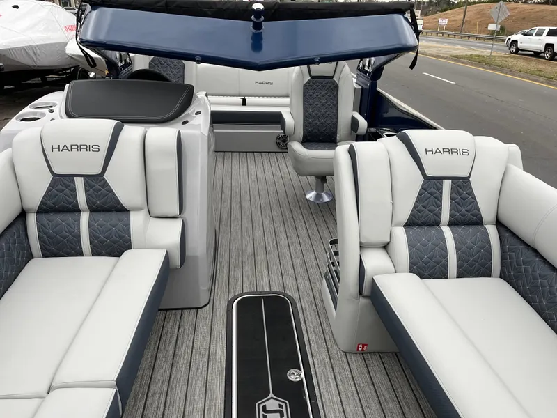 Slide: The Image of 2025 Harris Grand Mariner 250 pontoon boat interior with luxurious seating and modern design. - 8