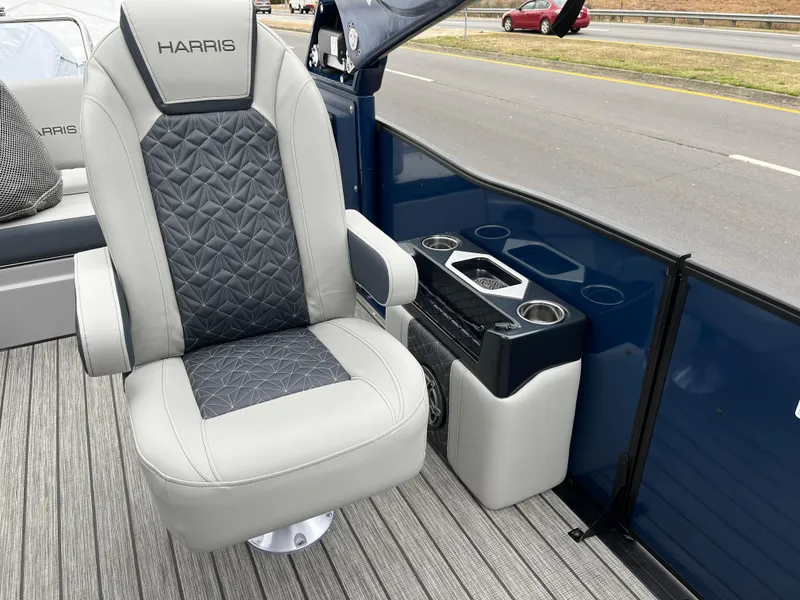 Slide: The Image of 2025 Harris Grand Mariner 250 boat seat with cup holders and modern design. - 9
