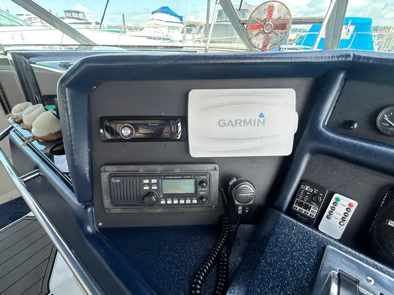 Slide: The Image of Control panel of a 1990 Sea Ray 350 Sundancer with Garmin navigation system. - 15