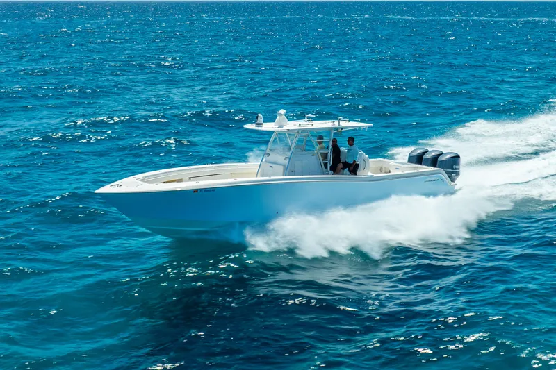 The Image of 2016 Invincible 39 boat cruising on open blue ocean waters. - 0