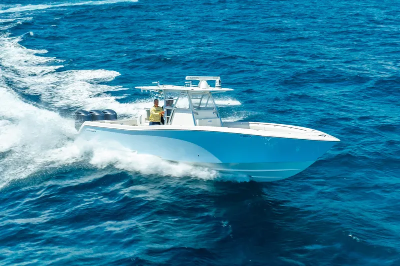 Slide: The Image of 2016 Invincible 39 boat cruising on open blue ocean waters. - 14