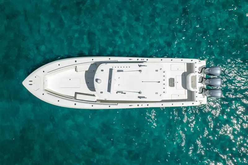 Slide: The Image of Aerial view of 2016 Invincible 39 boat on clear turquoise water. - 18