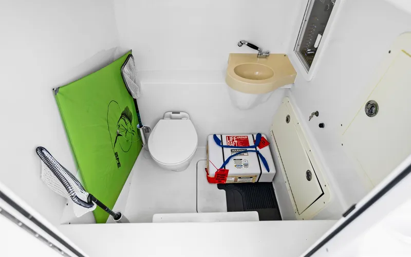 Slide: The Image of Compact bathroom in 2016 Invincible 39 boat with toilet, sink, and storage. - 26