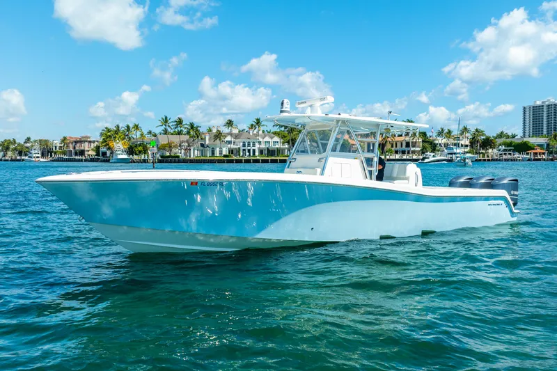 Slide: The Image of 2016 Invincible 39 boat on clear blue water under a sunny sky. - 3