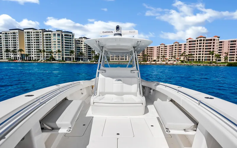 Slide: The Image of 2016 Invincible 39 boat on water with cityscape background. - 31