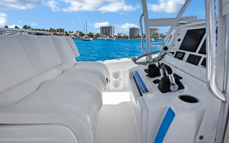 Slide: The Image of Interior view of 2016 Invincible 39 boat with modern controls and seating. - 34