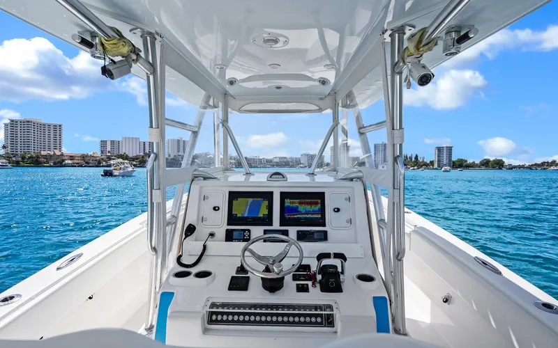 Slide: The Image of Center console of 2016 Invincible 39 boat with ocean view and city skyline. - 36