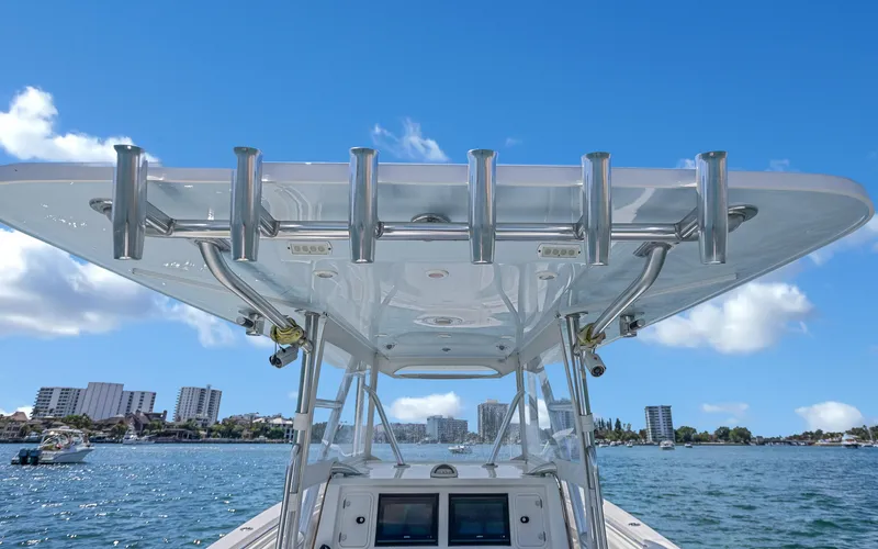Slide: The Image of Invincible 39 boat, 2016 model, on water with city skyline in background. - 37