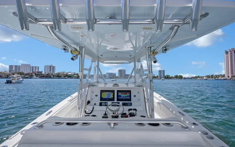 Slide: The Image of 2016 Invincible 39 boat dashboard with city skyline in the background. - 38