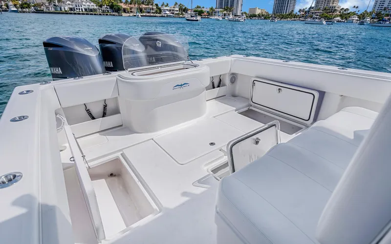 Slide: The Image of Invincible 39 boat interior with Yamaha engines, docked on a sunny day, 2016 model. - 44