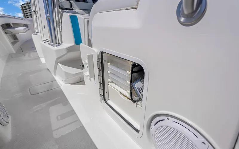 Slide: The Image of 2016 Invincible 39 boat interior with storage compartment and speaker. - 48