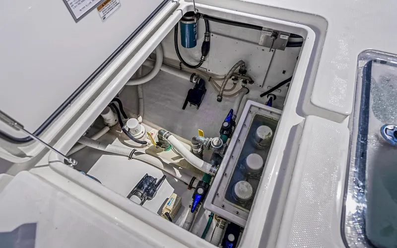 Slide: The Image of Engine compartment of 2016 Invincible 39 boat, showcasing mechanical components and wiring. - 49