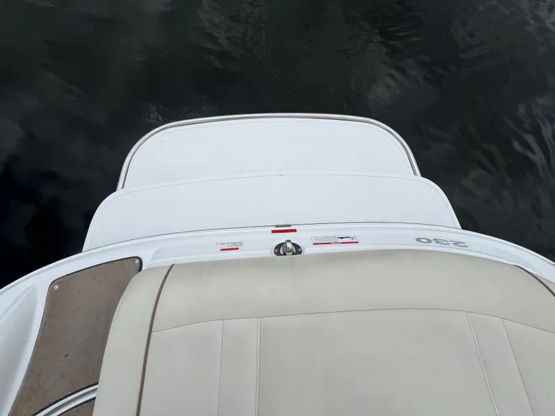 Slide: The Image of 2009 Cobalt 230 boat stern view with swim platform on water. - 11