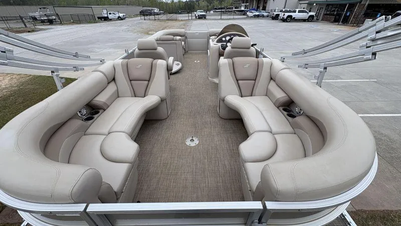Slide: The Image of 2016 Starcraft EX23 R pontoon boat with beige seating and spacious deck layout. - 6