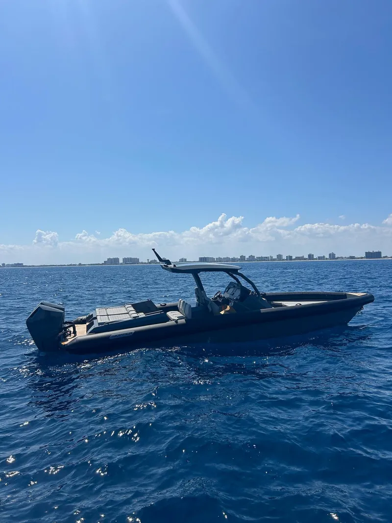 Slide: The Image of 2025 Skipper-BSK 38 boat on open sea under clear blue sky. - 10