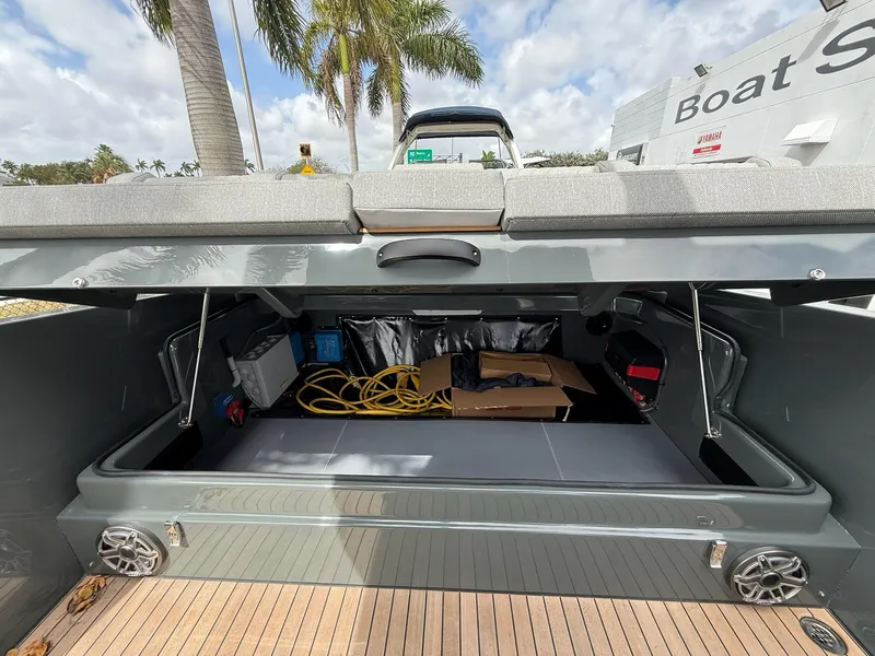 Slide: The Image of 2025 Skipper-BSK 38 boat storage compartment with open hatch, showcasing interior space and equipment. - 17