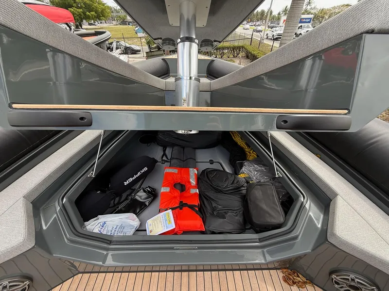 Slide: The Image of Open storage compartment of Skipper-BSK 38 boat, showcasing organized gear and equipment. - 22