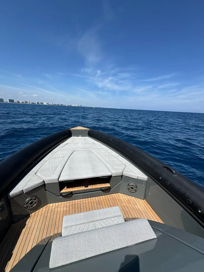 Slide: The Image of 2025 Skipper-BSK 38 boat cruising on open sea under clear blue sky. - 8