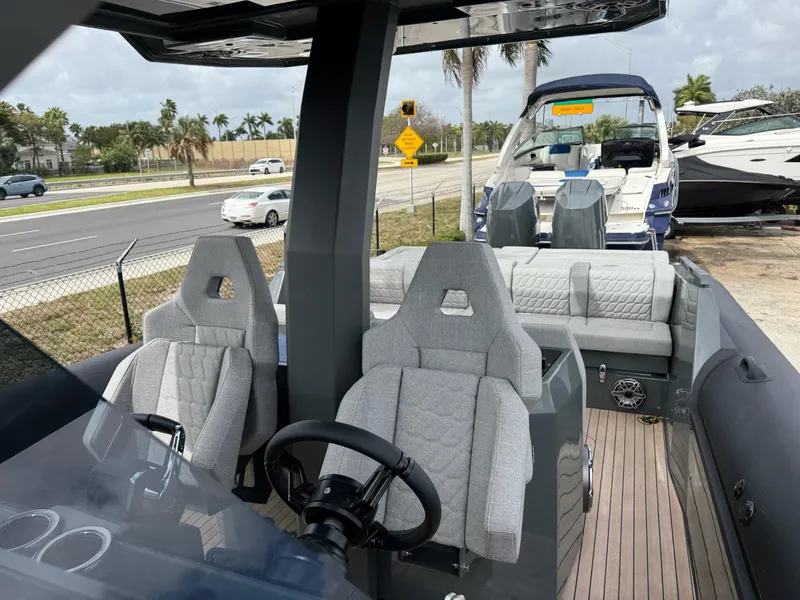 Slide: The Image of Modern Skipper-BSK 38 boat interior with sleek seating, steering wheel, and outdoor view, 2025 model. - 20